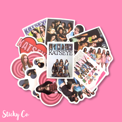 Collection of 'KATSEYE' stickers on a pink background
